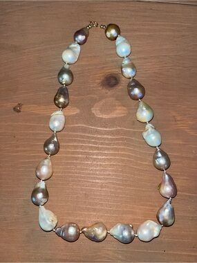 Baroque pearl necklace gold clasp and bead accents. Elegant timeless design.